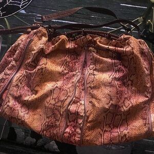 Huge Rampage. Shades of pink brown ivory. Draw string closure.unique